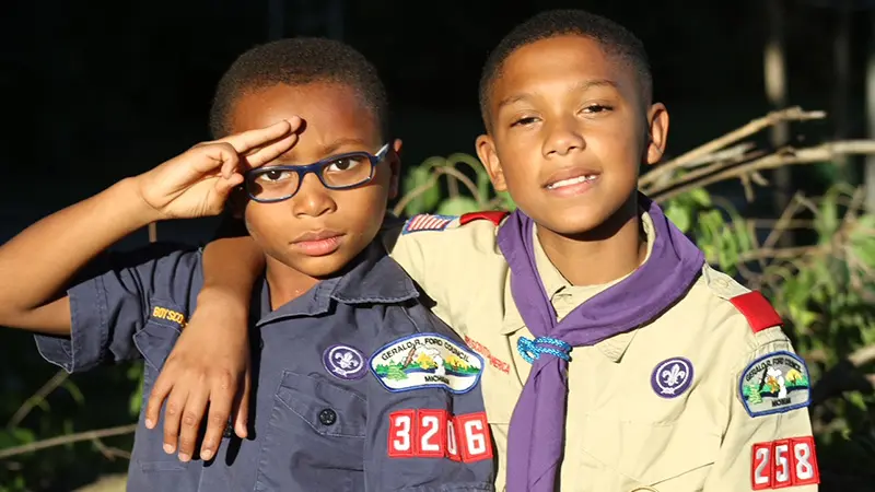 Two Scouts Shoulder To Shoulder Saluting